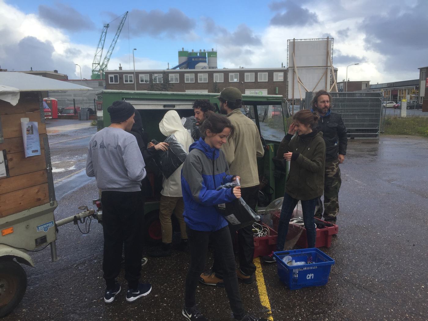 A team working outdoors in the rain